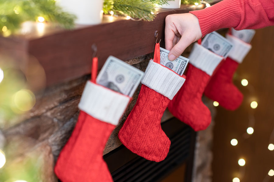 Dollars Being Stuffed into Holiday stockings at the local federal credit union Harlingen, TX