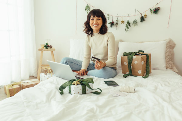 Debunking 3 Personal Loan Myths from our Harlingen Credit Union 1 woman on mattress while holiday shopping at Valley Credit Union Banks, Harlingen