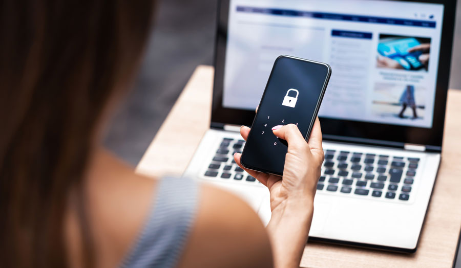 woman staying cybersafe with the VFCU credit union Brownsville App