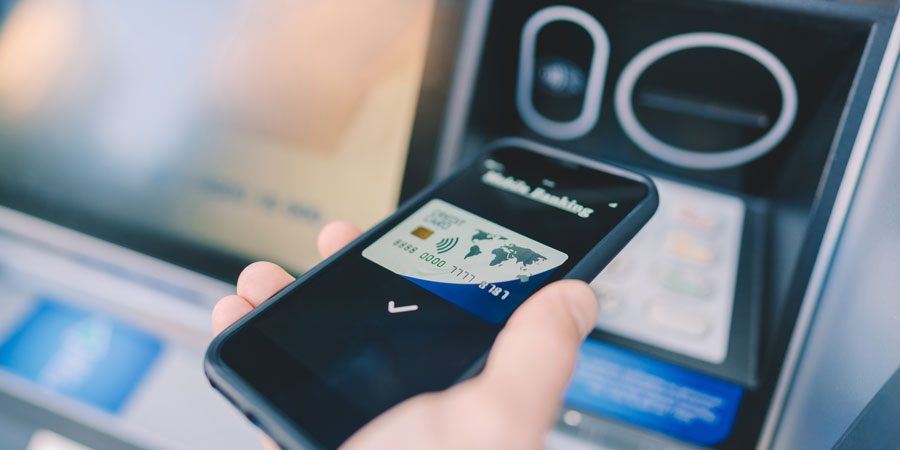Person using Apple pay from VFCU credit Union Harlingen Location